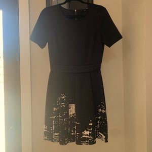 Black dress with city scape printed skirt